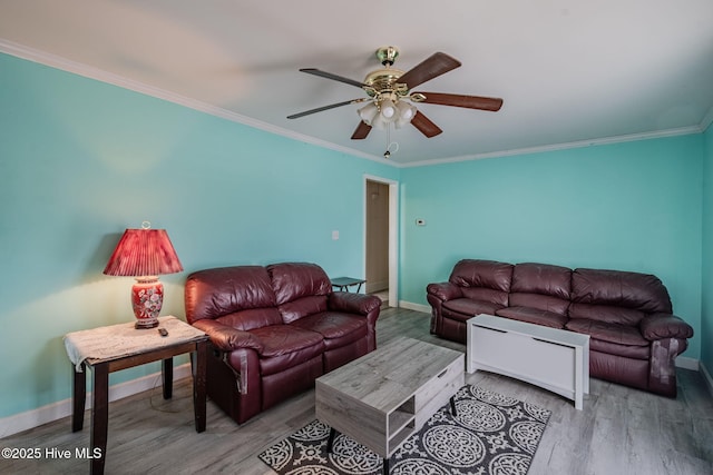 living room with ornamental molding, hardwood / wood-style floors, and ceiling fan