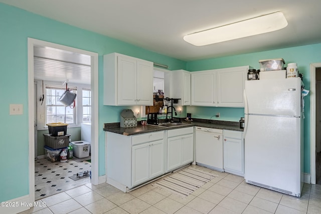 kitchen featuring white cabinetry, white appliances, and sink