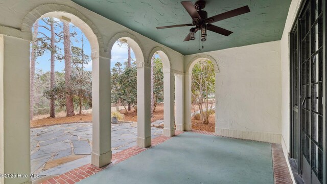 view of patio featuring ceiling fan