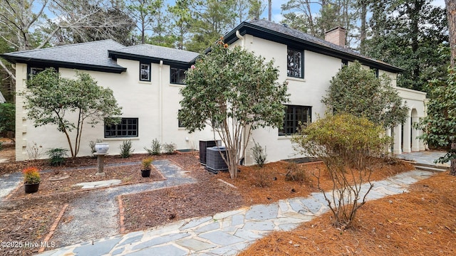 view of side of home featuring central air condition unit