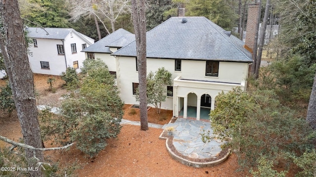 rear view of house featuring a patio area