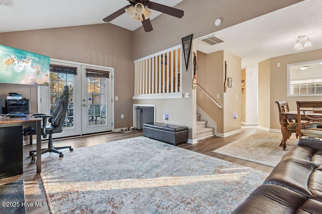 office space with french doors, ceiling fan, vaulted ceiling, and hardwood / wood-style floors