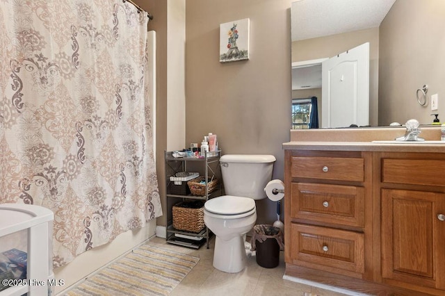 full bathroom featuring vanity, tile patterned flooring, shower / bath combo, and toilet