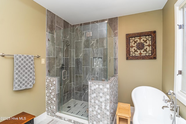 bathroom with separate shower and tub