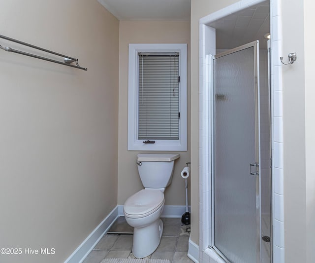 bathroom with an enclosed shower, tile patterned floors, and toilet