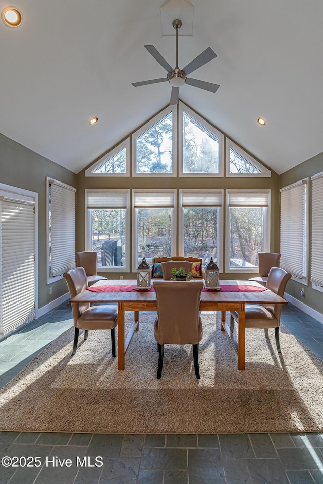 sunroom / solarium featuring plenty of natural light and vaulted ceiling