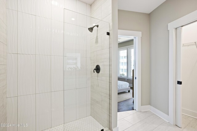 bathroom with tile patterned floors and a shower with shower door