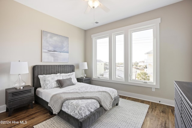 bedroom with dark wood-type flooring and ceiling fan