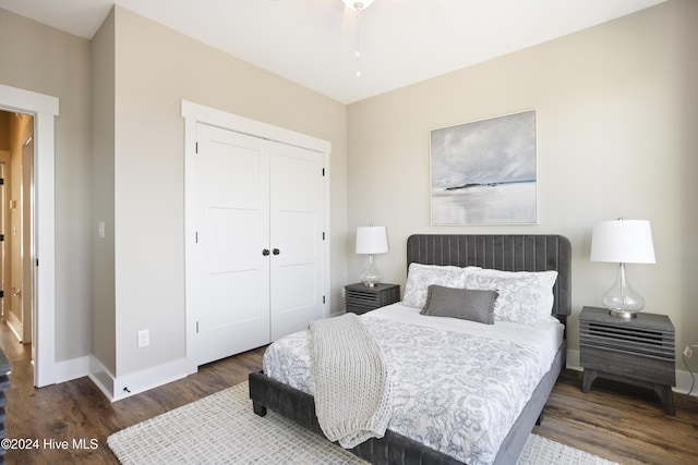 bedroom with ceiling fan, dark hardwood / wood-style flooring, and a closet