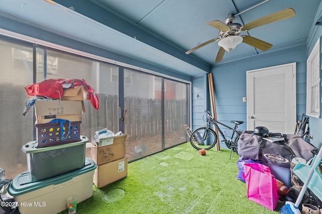 sunroom featuring ceiling fan and a healthy amount of sunlight