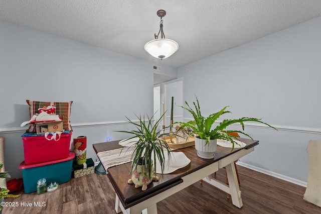 office area featuring dark hardwood / wood-style floors and a textured ceiling