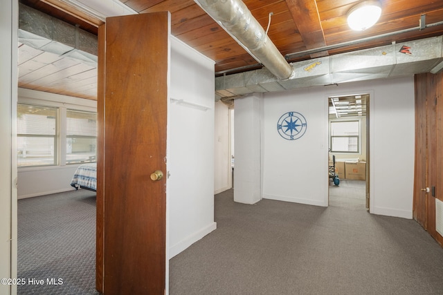 basement with dark colored carpet