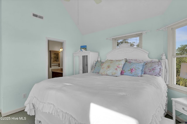 bedroom featuring connected bathroom, light tile patterned floors, high vaulted ceiling, and ceiling fan