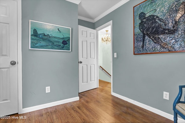 interior space featuring hardwood / wood-style flooring and ornamental molding