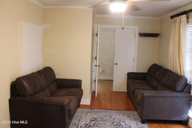 living room with ornamental molding and hardwood / wood-style floors