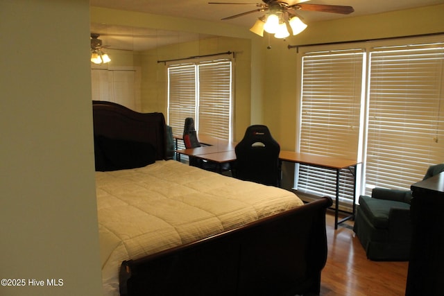 bedroom featuring ceiling fan and hardwood / wood-style floors