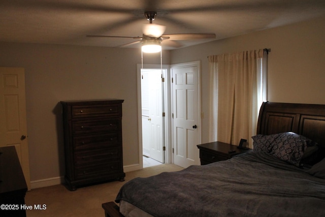 bedroom with light carpet and ceiling fan