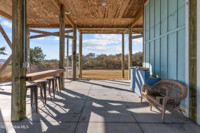 view of patio / terrace featuring an outdoor bar