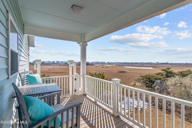 balcony featuring a rural view