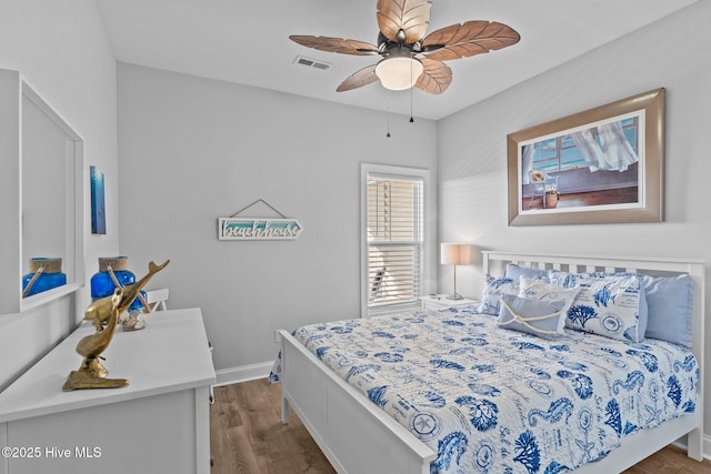 bedroom featuring ceiling fan and dark hardwood / wood-style flooring