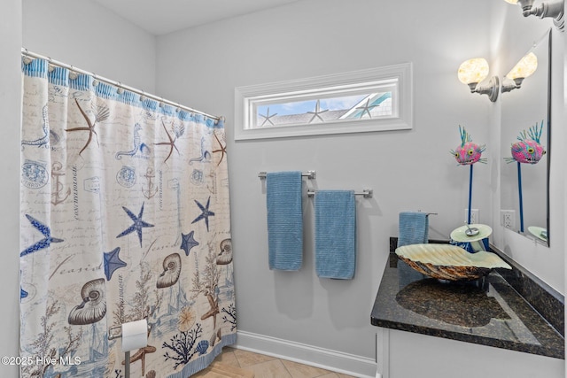 bathroom with tile patterned flooring, vanity, and a shower with shower curtain