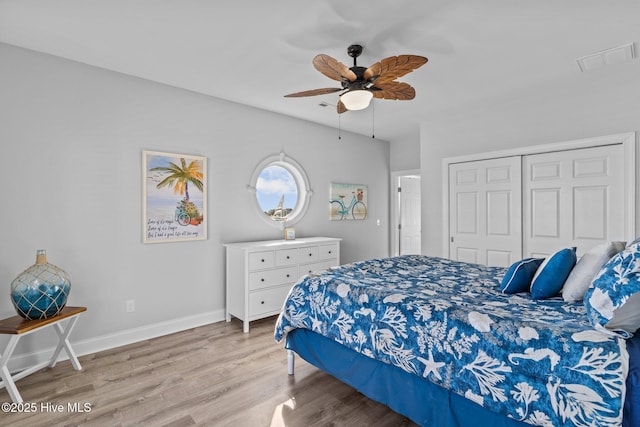 bedroom featuring a closet, ceiling fan, and light hardwood / wood-style flooring