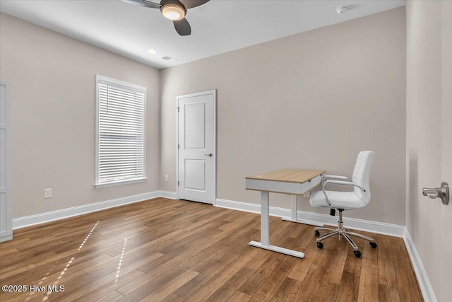 office with ceiling fan and wood-type flooring