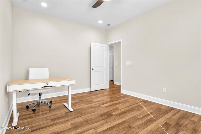 office space with hardwood / wood-style floors and ceiling fan