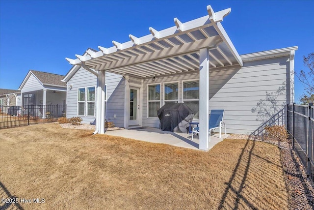 back of house with a patio, a sunroom, a yard, and a pergola