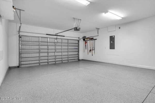 garage featuring a garage door opener and electric panel