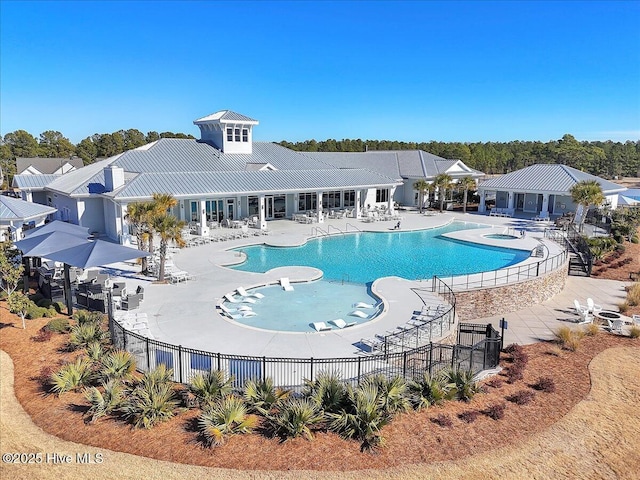 view of swimming pool with a community hot tub and a patio area