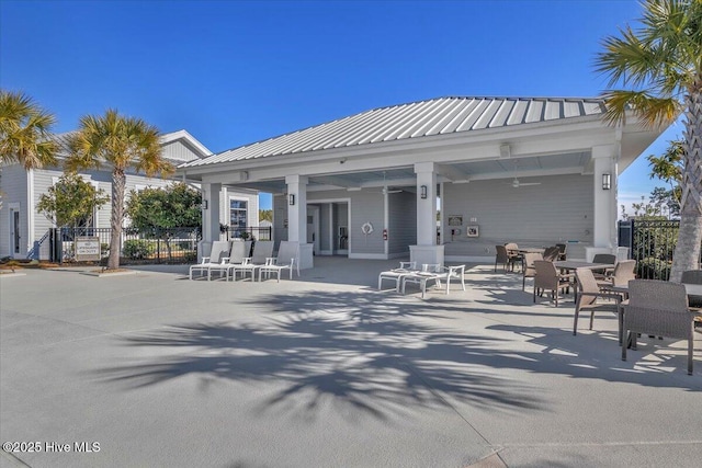 back of house with a patio area and ceiling fan