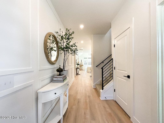 hall with light hardwood / wood-style floors