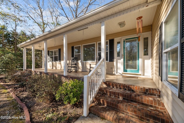 doorway to property featuring a porch