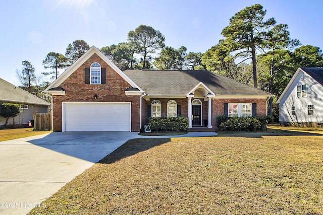 view of front of home featuring a garage and a front lawn