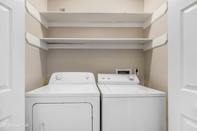 washroom with laundry area and separate washer and dryer