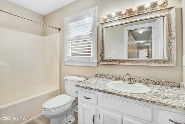 full bathroom with toilet, bathing tub / shower combination, and vanity