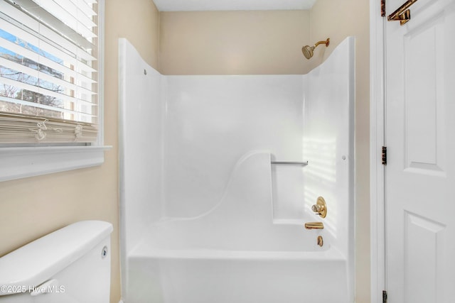 full bath featuring toilet and bathing tub / shower combination