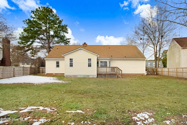 back of house featuring a patio area, a fenced backyard, a lawn, and a wooden deck