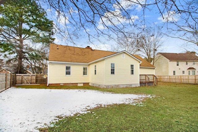 back of property featuring a chimney, a lawn, crawl space, a fenced backyard, and a wooden deck