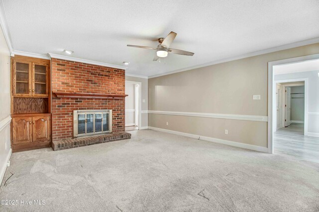 carpeted spare room featuring crown molding and a textured ceiling