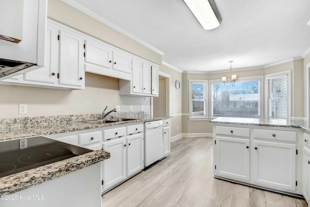 kitchen featuring hanging light fixtures, sink, white cabinets, and white dishwasher