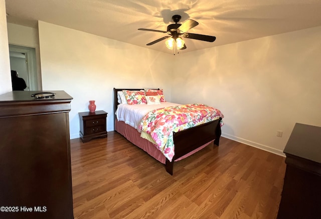 bedroom featuring wood-type flooring and ceiling fan