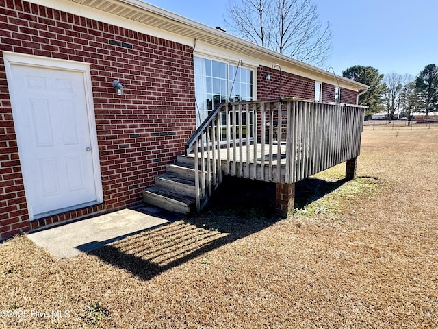 entrance to property with a deck