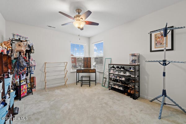 misc room featuring carpet floors and ceiling fan