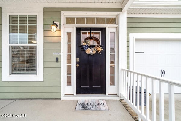 entrance to property featuring a garage