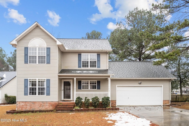 view of front of house with a garage and covered porch