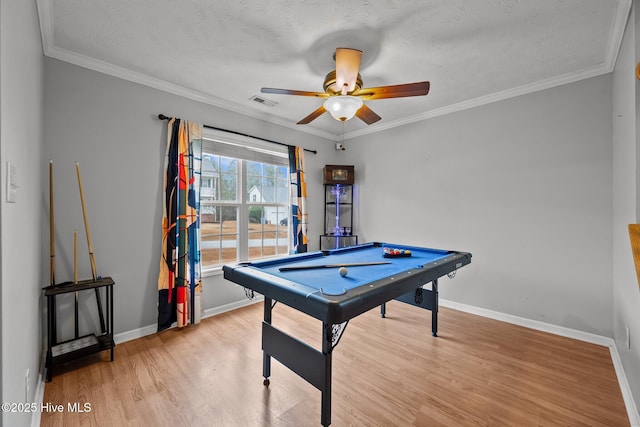 playroom with light hardwood / wood-style flooring, ceiling fan, ornamental molding, a textured ceiling, and pool table