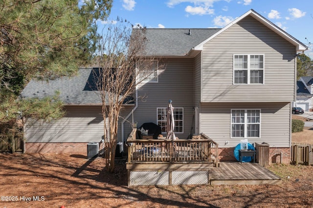 back of house featuring a wooden deck and cooling unit