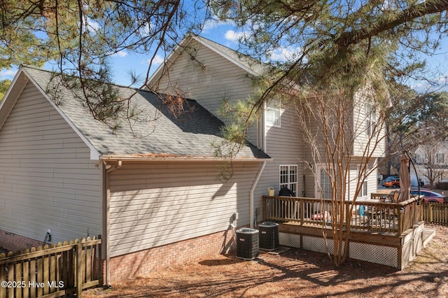 back of property featuring a wooden deck and central AC unit